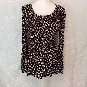Maurices elastic black with white flowers peplum top M
